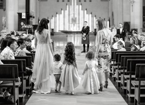 Black and white photo of flower girls walking down aisle at Perth wedding
