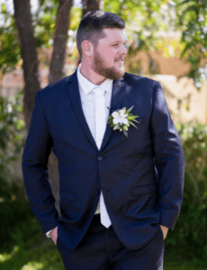 Groom posing before ceremony