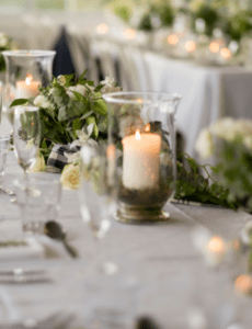 candles and greenery reception table setting