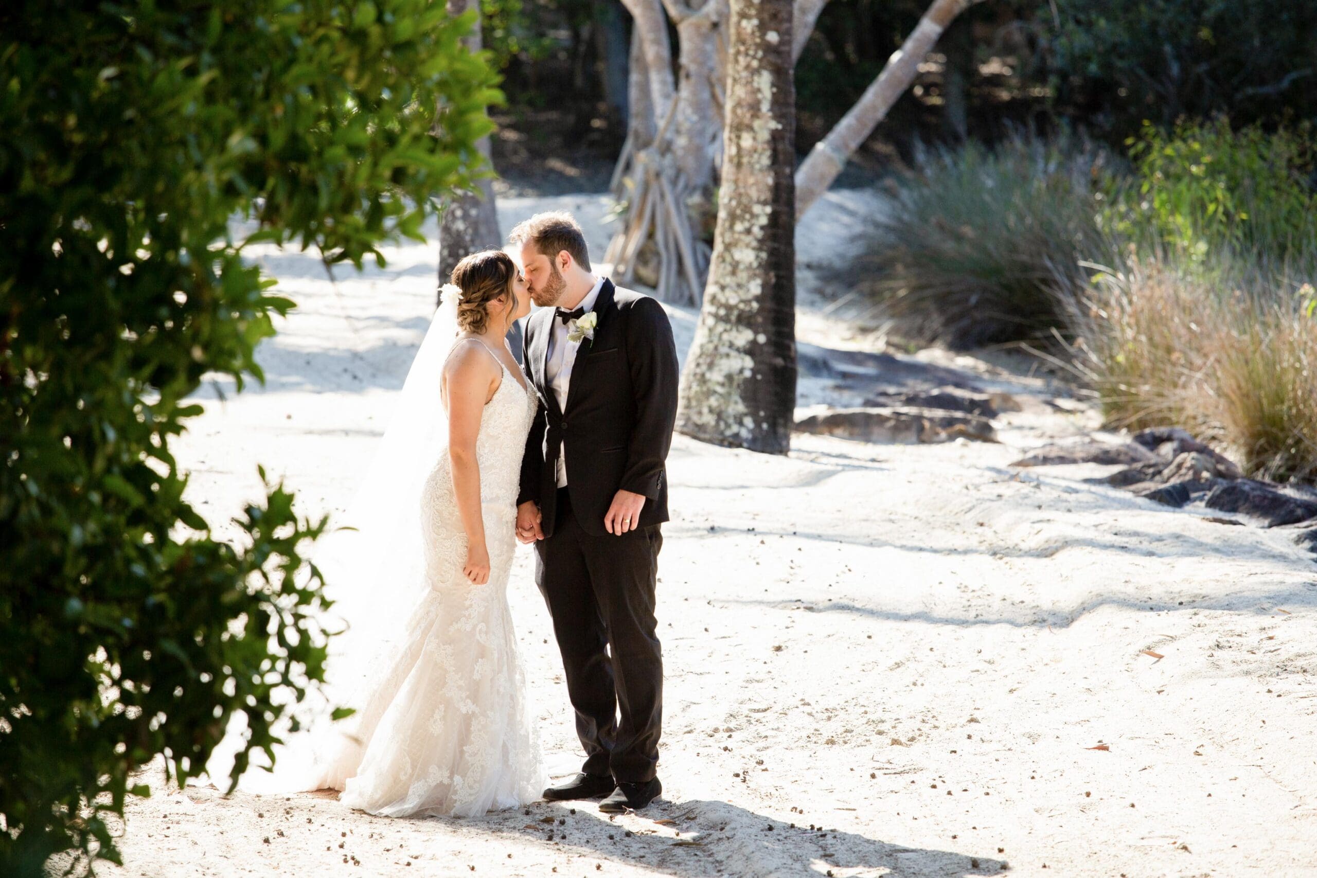 Bride and groom kissing.