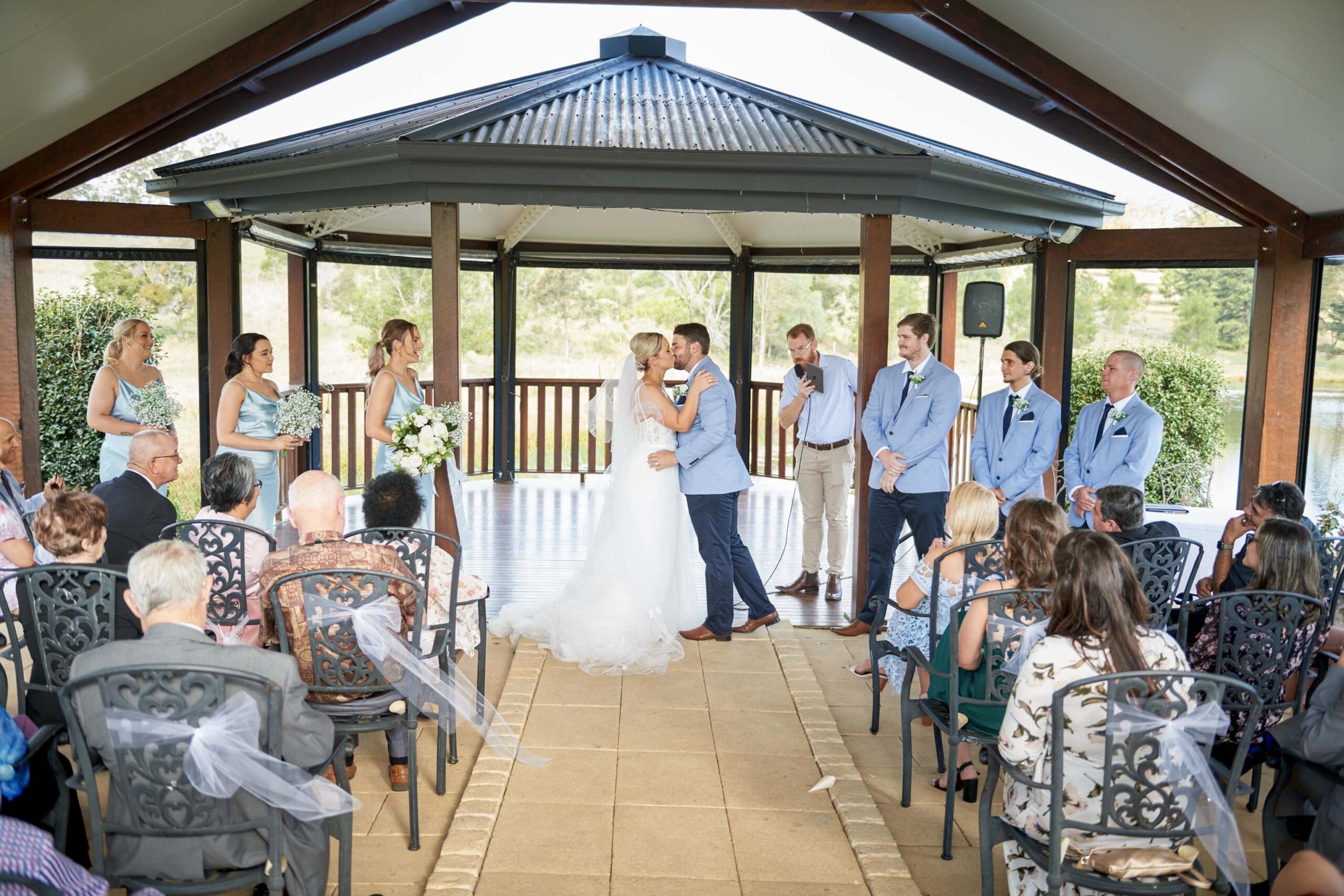 bride and groom kissing at wedding ceremony at Ocean View Estates in Brisbane