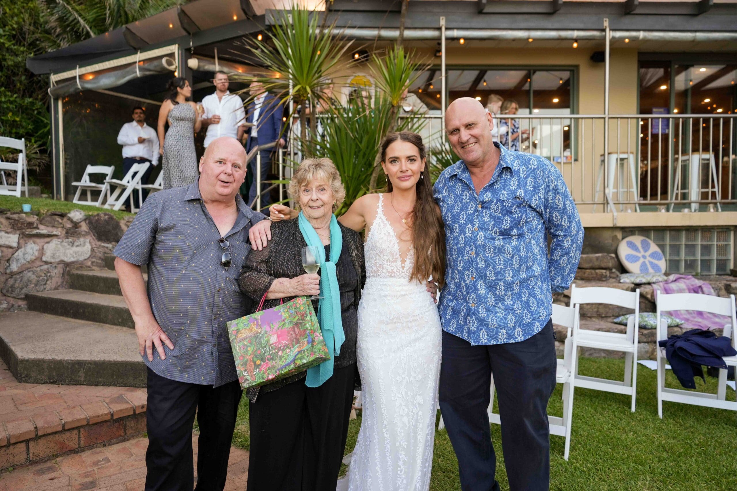 guests at sunset wedding posing for Sydney wedding photographer