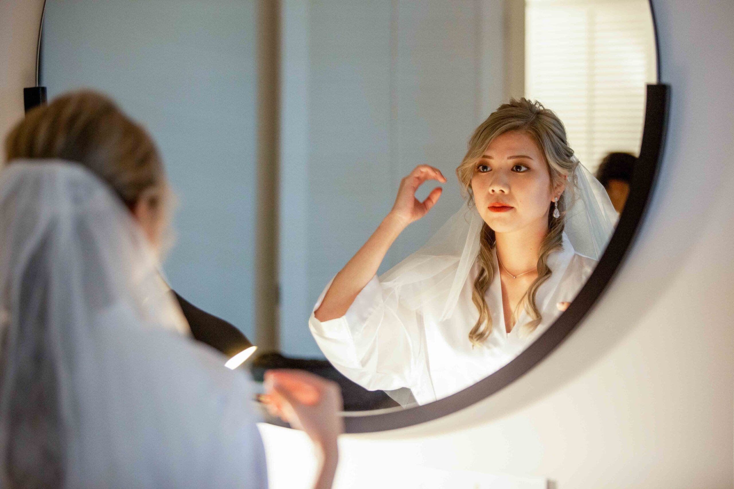 bride trying in veil before wedding in Brisbane