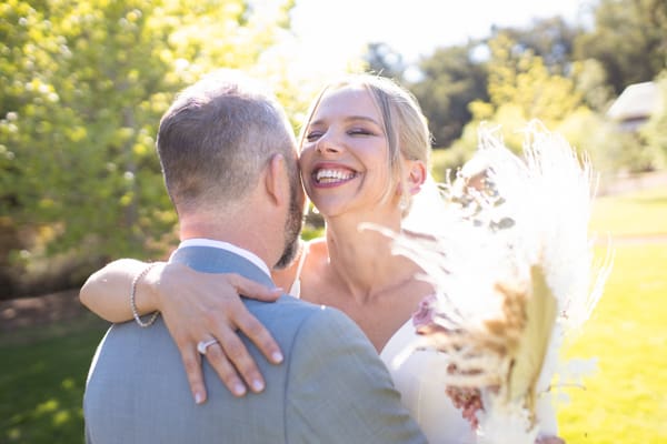 bride and groom hugging at wedding in Perth