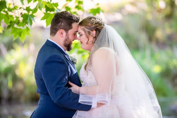 bride and groom posing for wedding photographer in Perth